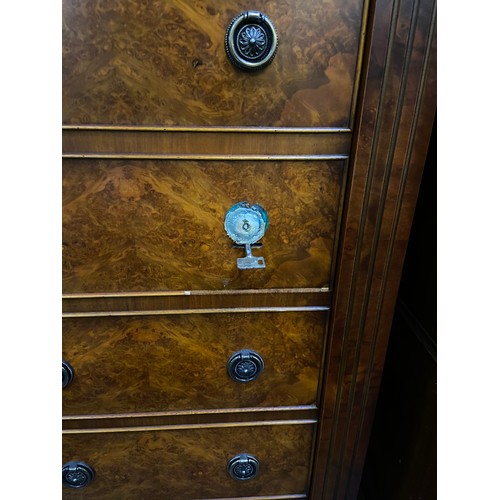 476 - Modern dark walnut veneered incognito gun cabinet in the form of a tallboy chest of drawers.