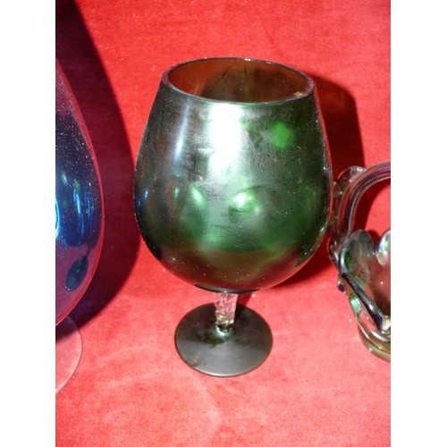 75 - LARGE AMBER GLASS PEDESTAL BOWL PLUS A LARGE BLUE BRANDY GLASS, GREEN BRANDY GLASS AND A GREEN GLASS... 