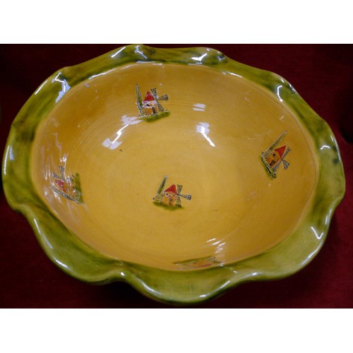 333 - Earthenware scalloped rim wash bowl and jug, decorated with mustard & green glaze and pictorial cott... 