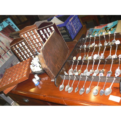 292 - LARGE COLECTION OF MOSTLY CERAMIC THIMBLES WITH DISPLAY CASES PLUS SOUVENIR SPOONS ON A WALL RACK