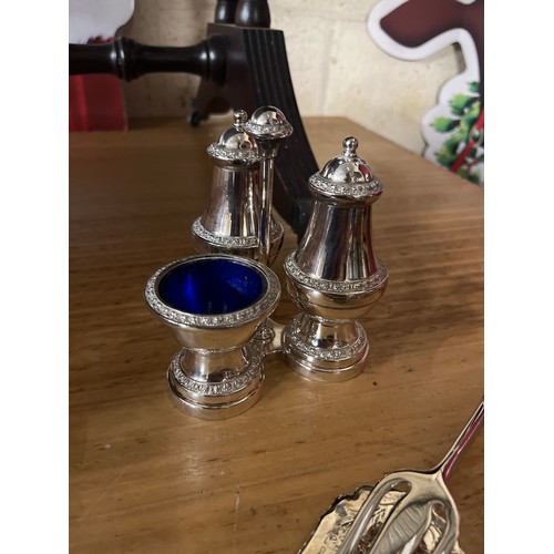 416 - SILVERPLATE CRUET SET AND CONDIMENT SET WITH BLUE GLASS LINERS AND A SET OF SERVING TONGS