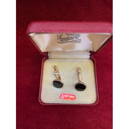 28B - Good quality pair of gilt metal and black glass cufflinks.