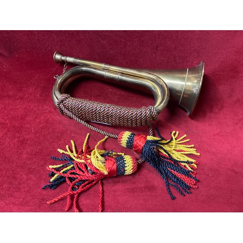 83 - VINTAGE BRASS BUGLE WITH RED, YELLOW AND BLACK BRAIDING