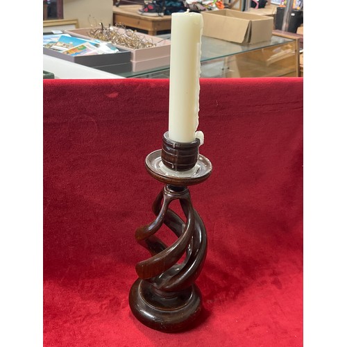 91 - A LOVELY HAND CARVED FROM A SOLID PIECE OF WOOD  CANDLE HOLDER IN SPIRAL DESIGN PLUS A CANDLE