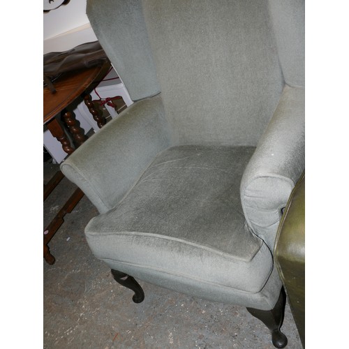 406 - LIGHT GREEN WING-BACK ARMCHAIR BY CHRISTIE TYLER