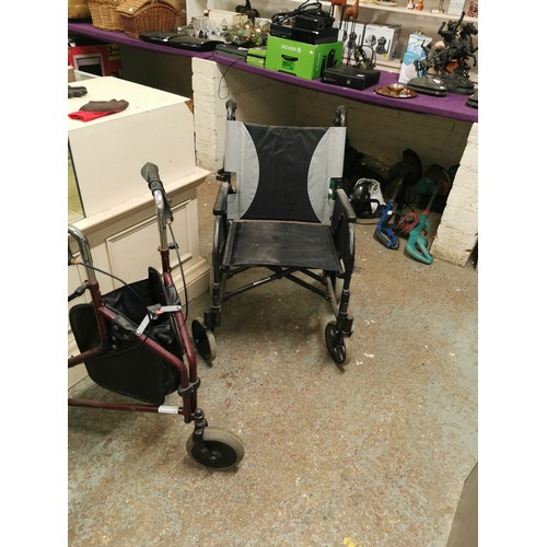 413C - A BLACK FOLDING WHEEL CHAIR ALONG WITH A FOLDING WALKER