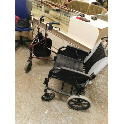 413C - A BLACK FOLDING WHEEL CHAIR ALONG WITH A FOLDING WALKER