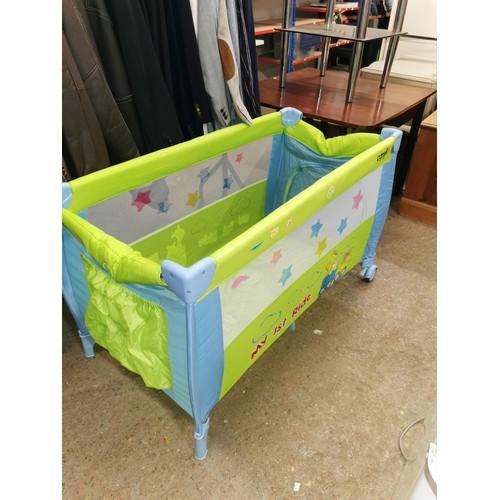 413H - COLOURFULL TRAVEL COT BY CARELLO IN GOOD CLEAN CONDITION