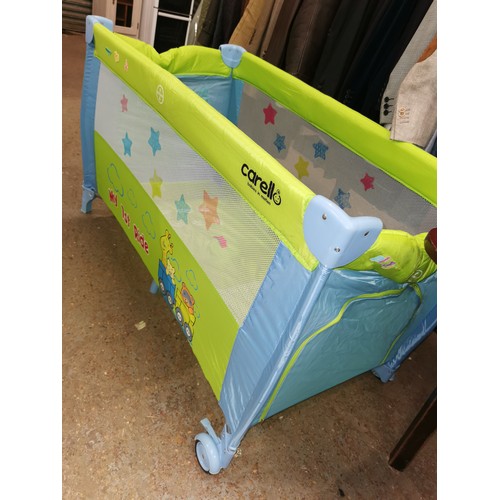 413H - COLOURFULL TRAVEL COT BY CARELLO IN GOOD CLEAN CONDITION