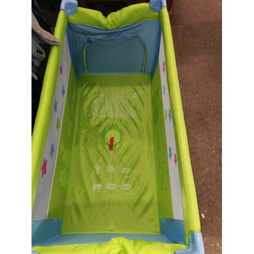 413H - COLOURFULL TRAVEL COT BY CARELLO IN GOOD CLEAN CONDITION