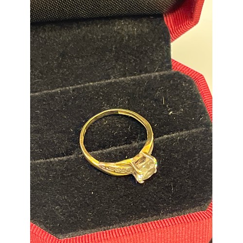 21 - A LOVELY 9CT GOLD ENGAGEMENT RING WITH LARGE WHITE STONE AND STONES ON THE SHANKS SIZE L WEIGHT 1.7g... 