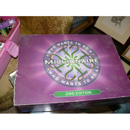 287B - 2 BOARD GAMES WHO WANTS TO BE A MILLIONAIRE AND TRIVIAL PURSUIT PLUS A TUB OF STATIONERY ITEMS