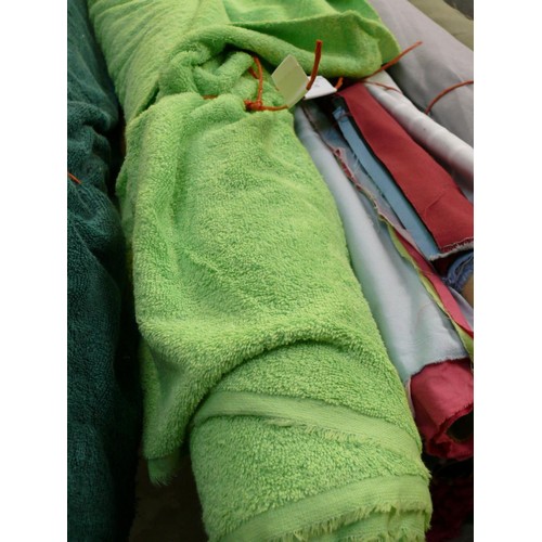 335 - PART ROLL OF LIGHT GREEN TOWELLING FABRIC