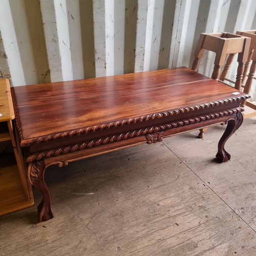 484 - SOLID CLAW FOOTED COFFEE TABLE IN A DARK WOOD FINISH