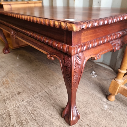 484 - SOLID CLAW FOOTED COFFEE TABLE IN A DARK WOOD FINISH