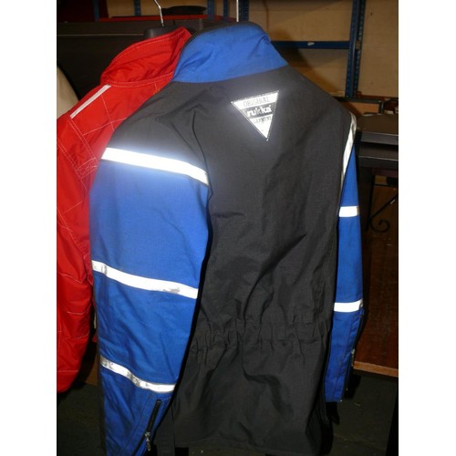 300 - FERRARI F1 WORLD CHAMPIONSHIP TEAM JACKET IN RED AND A RUKKA GORE-TEX MOTORBIKE JACKET SIZE 54