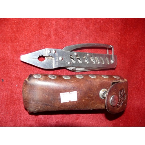 32 - STAINLESS STEEL MULTI TOOL IN LEATHER CASE PLUS A LEATHERMAN TOOL IN CASE AND ANCIENT WARRIOR CORKSC... 