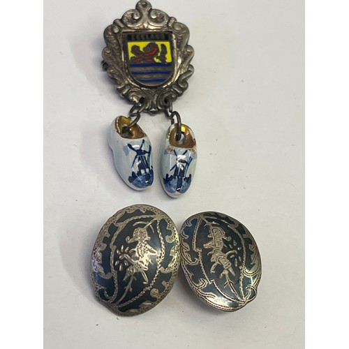 53 - A PAIR OF SIAM SILVER CLIP ON EARRINGS AND A ZEELAND PIN BADGE WITH MINIATURE CLOGS