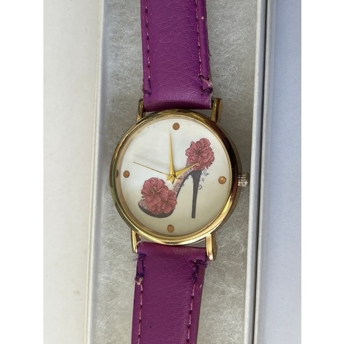 26 - LADIES PURPLE WATCH WITH SHOE DESIGN