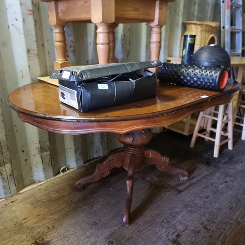 468 - OVAL BROWN DINNING TABLE WITH CARVED BASE