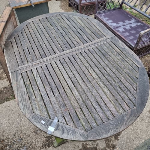 503 - LARGE WOODEN OVAL GARDEN TABLE