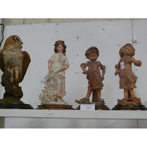 102 - 4 DECORATIVE FIGURINES 1 OWL AND 3 CHILDREN