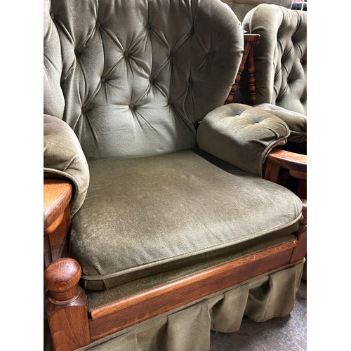 407 - A VERY COMFORTABLE TWO SEATER WOODEN FRAMED SOFA IN GREEN DRALON, BUTTONED BACKS AND ARM RESTS. WITH... 