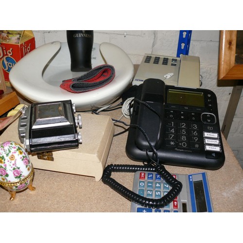 182 - A SHELF OF ECLECTIC BRIC-A-BRAC. TELEPHONES, CAMERA, WOOD SCREWS, RUBBER GLASS OF GUINNESS ETC