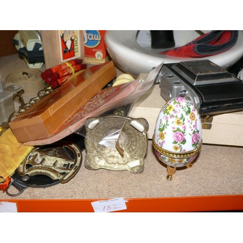 182 - A SHELF OF ECLECTIC BRIC-A-BRAC. TELEPHONES, CAMERA, WOOD SCREWS, RUBBER GLASS OF GUINNESS ETC