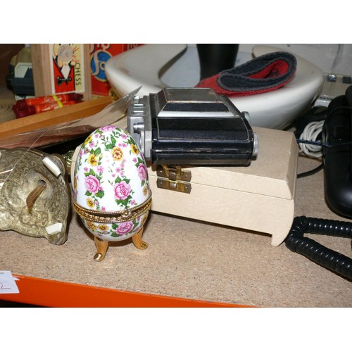 182 - A SHELF OF ECLECTIC BRIC-A-BRAC. TELEPHONES, CAMERA, WOOD SCREWS, RUBBER GLASS OF GUINNESS ETC