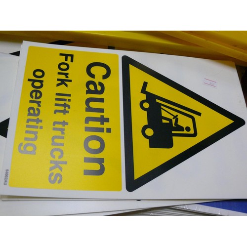 219 - 2 X WET FLOOR WARNING MARKS TOGETHER WITH MANY FIRE EXIT, CAUTION SIGNS ETC