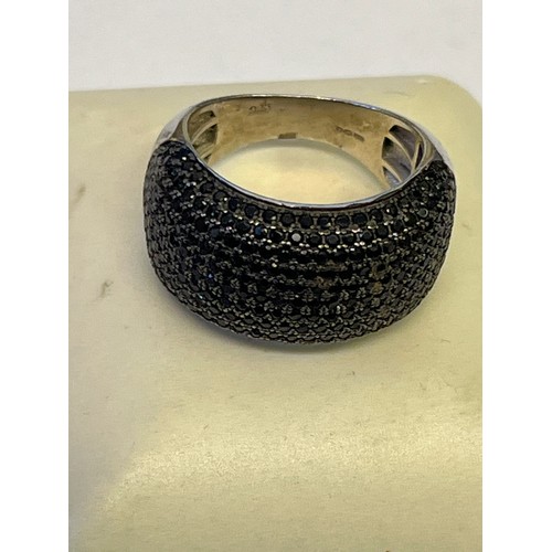 27 - A SOLID SILVER RING WITH BLACK DIAMOND SIZE Q