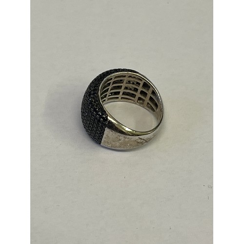 27 - A SOLID SILVER RING WITH BLACK DIAMOND SIZE Q