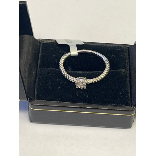 29 - A SOLID SILVER AND DIAMOND RING SIZE U NEW WITH TAG