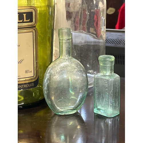 268 - A LARGE MARTELL COGNAC GREEN GLASS BOTTLE PLUS A PAIR OF DEMI JOHNS AND 2 SMALL GLASS BOTTLES