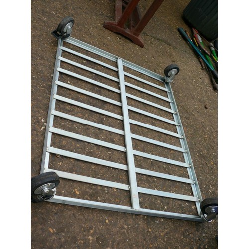 308 - MOVING METAL FRAMED DOLLY ON LOCKABLE CASTERS, APPROX 2FTX2.6FT