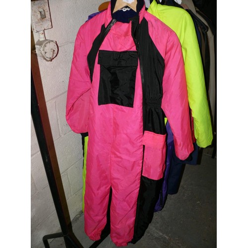 358 - 2 ADULT FLYING SUITS IN PINK AND FLUORESCENT YELLOW