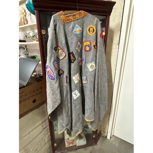 59 - VINTAGE CAMP PONCHO WITH A LARGE COLLECTION OF PATCH BADGES STITCHED ONTO IT, MANY SCOUTING TO INCLU... 