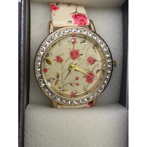 55 - A STRADA WATCH NEW IN BOX WITH DIAMANTES AND FLOWERS VERY BLINGY