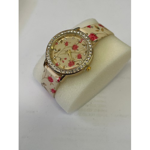 55 - A STRADA WATCH NEW IN BOX WITH DIAMANTES AND FLOWERS VERY BLINGY