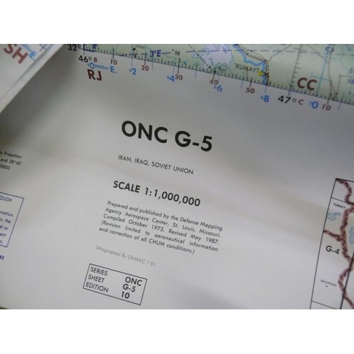 417 - 4 LARGE OPERATIONAL NAVIGATION CHARTS AND A MAP OF THE WORLD