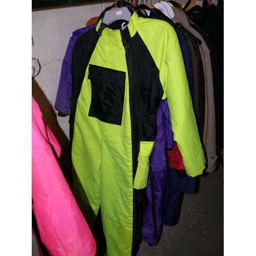 358 - 2 ADULT FLYING SUITS IN PINK AND FLUORESCENT YELLOW