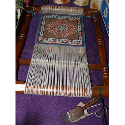 103 - A VINTAGE WOODEN TAPESTRY / RUG MAKING FRAME WITH COMPLETED PANEL AND TOOLS