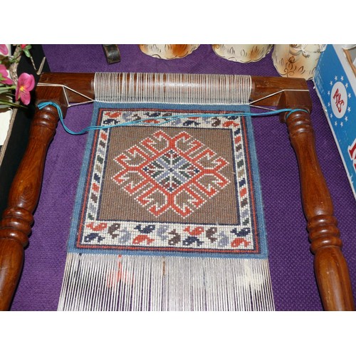 103 - A VINTAGE WOODEN TAPESTRY / RUG MAKING FRAME WITH COMPLETED PANEL AND TOOLS