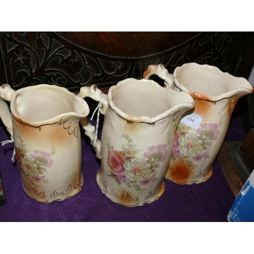 104 - A GRADUATED SET OF 3 VICTORIAN JUGS IN CROWN DEVON STYLE