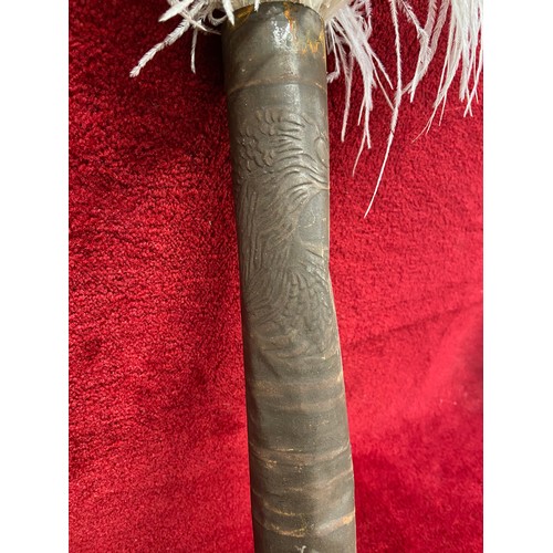 177 - Antique tin tube embossed with a cockerel holding a key, containing 3x Ostrich feather plumes.