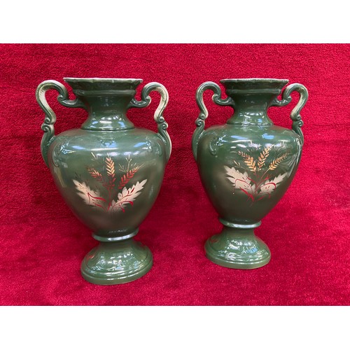 189 - Pair of large Conquest made in England urn shaped vases. Green and gilt with floral decoration, patt... 