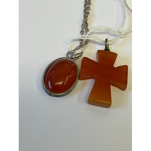 37 - A SOLID SILVER AND CARNELIAN PENDANT ON SILVER CHAIN PLUS 1 OTHER A CROSS FROM BROWN AGATE