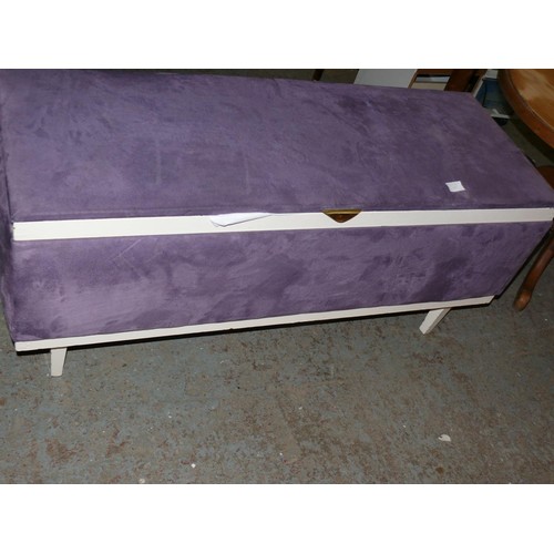 317 - 20TH CENTURY OTTOMAN UPHOLSTERED IN PURPLE VELOUR WITH CONTENTS OF PILLOWS