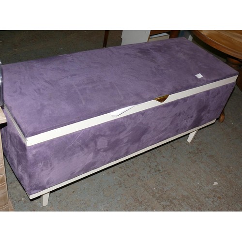 317 - 20TH CENTURY OTTOMAN UPHOLSTERED IN PURPLE VELOUR WITH CONTENTS OF PILLOWS